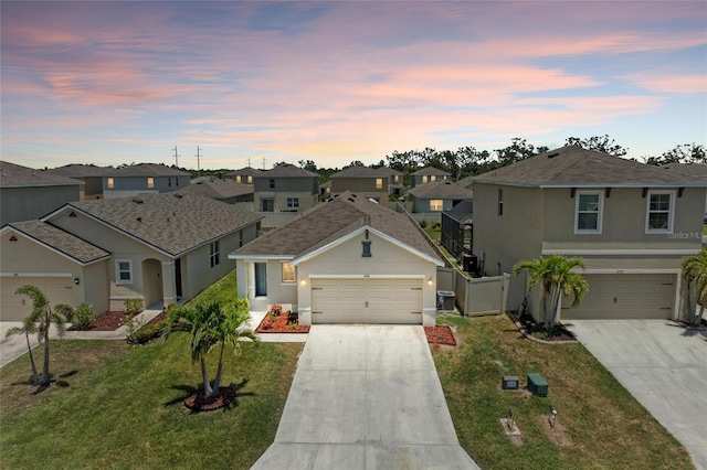 4206 Park Willow Ave, Palmetto, FL 34221 - traditional-style home with driveway, a residential view, and stucco siding
