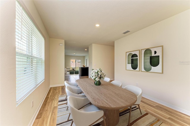 4206 Park Willow Ave, Palmetto, FL 34221 - dining area with light wood finished floors, recessed lighting, and baseboards