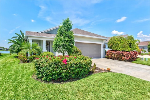 13849 Old Creek Ct, Parrish, FL 34219 - obstructed view of property featuring a garage, driveway, and a front yard