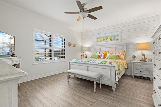 13849 Old Creek Ct, Parrish, FL 34219 - bedroom with ornamental molding, light wood-type flooring, wood walls, ceiling fan, and baseboards
