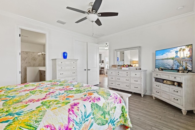 13849 Old Creek Ct, Parrish, FL 34219 - bedroom with ornamental molding, light wood-style floors, ensuite bath, and a ceiling fan