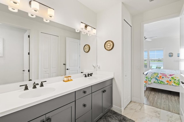 13849 Old Creek Ct, Parrish, FL 34219 - ensuite bathroom with double vanity, marble look tile flooring, baseboards, and a closet