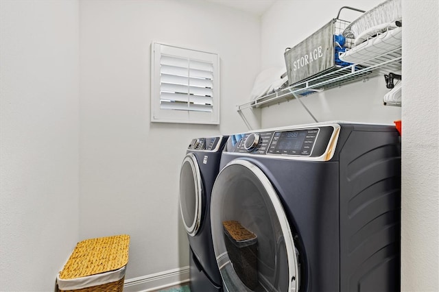 13849 Old Creek Ct, Parrish, FL 34219 - laundry room featuring washer and clothes dryer and baseboards