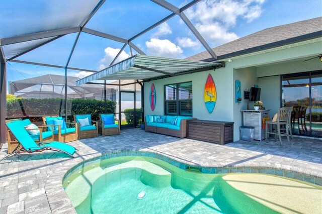 13849 Old Creek Ct, Parrish, FL 34219 - swimming pool with a patio, an outdoor living space, and glass enclosure