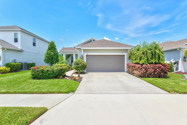 13849 Old Creek Ct, Parrish, FL 34219 - ranch-style house featuring a front yard, an attached garage, driveway, central AC unit, and roof with shingles