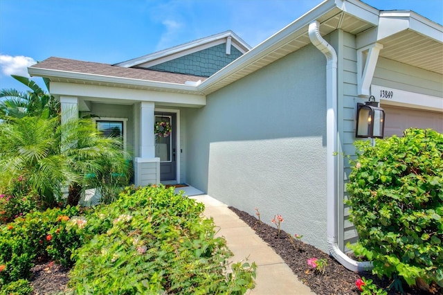 13849 Old Creek Ct, Parrish, FL 34219 - view of exterior entry featuring stucco siding