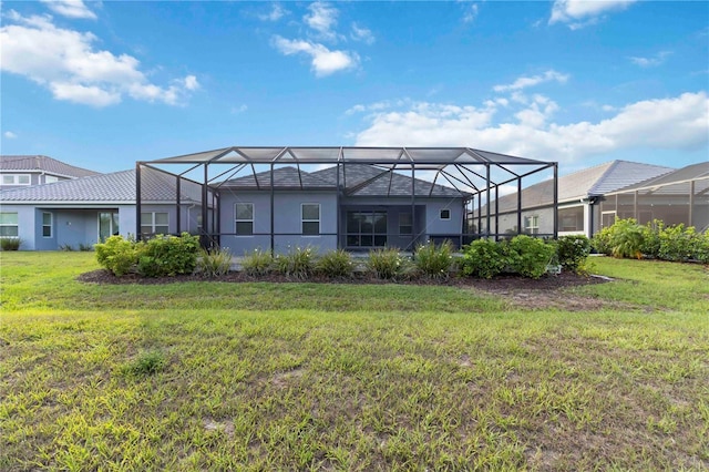 2794 Butterfly Jasmine Trl, Sarasota, FL 34240 - back of property with a lawn, stucco siding, and a lanai