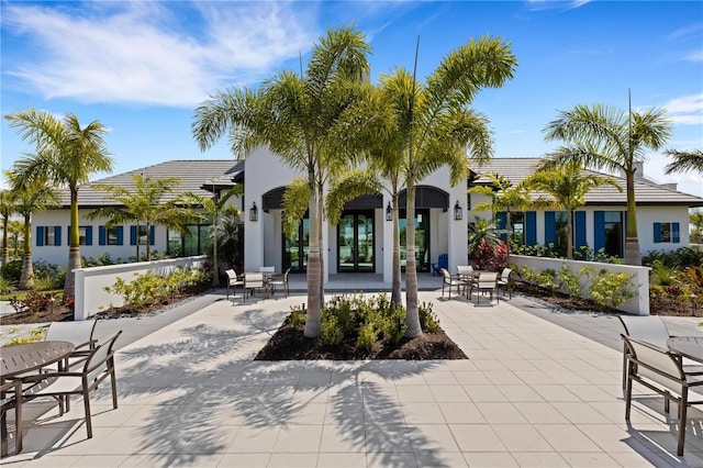 2794 Butterfly Jasmine Trl, Sarasota, FL 34240 - rear view of property with stucco siding, a patio, and a tiled roof