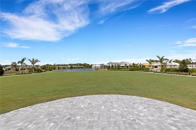 2794 Butterfly Jasmine Trl, Sarasota, FL 34240 - view of property's community featuring a residential view, a water view, a yard, and a patio area