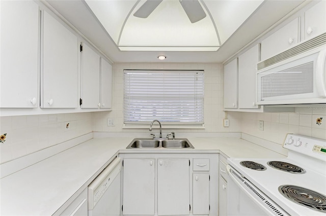 6030 7th Ave W Unit 6030, Bradenton, FL 34209 - kitchen with white appliances, a sink, white cabinets, tasteful backsplash, and light countertops