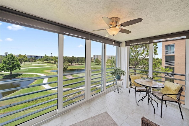 4570 Pinebrook Cir Unit 508, Bradenton, FL 34209 - sunroom / solarium with a water view, view of golf course, a textured ceiling, and tile patterned flooring