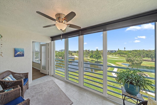 4570 Pinebrook Cir Unit 508, Bradenton, FL 34209 - sunroom featuring a ceiling fan, a water view, and golf course view