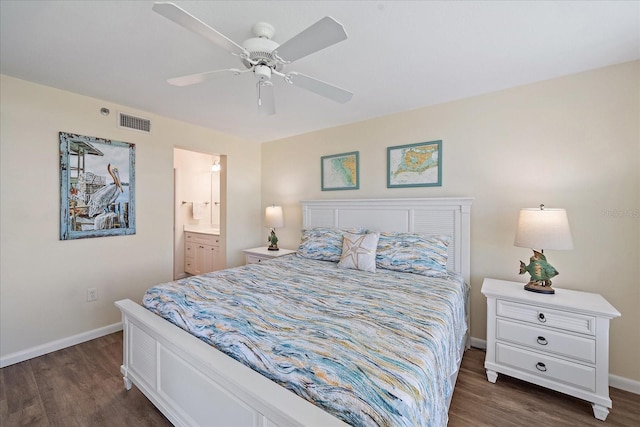 4570 Pinebrook Cir Unit 508, Bradenton, FL 34209 - bedroom with dark wood-style flooring, baseboards, ensuite bath, and a ceiling fan