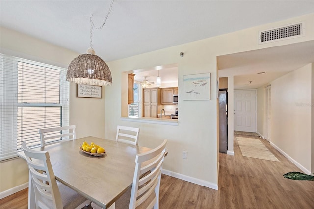 4570 Pinebrook Cir Unit 508, Bradenton, FL 34209 - dining room with wood finished floors and baseboards