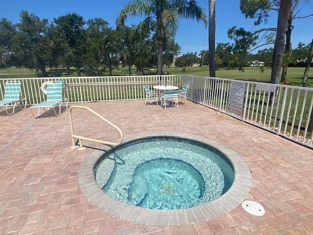 4570 Pinebrook Cir Unit 508, Bradenton, FL 34209 - view of pool with a community hot tub and a patio area