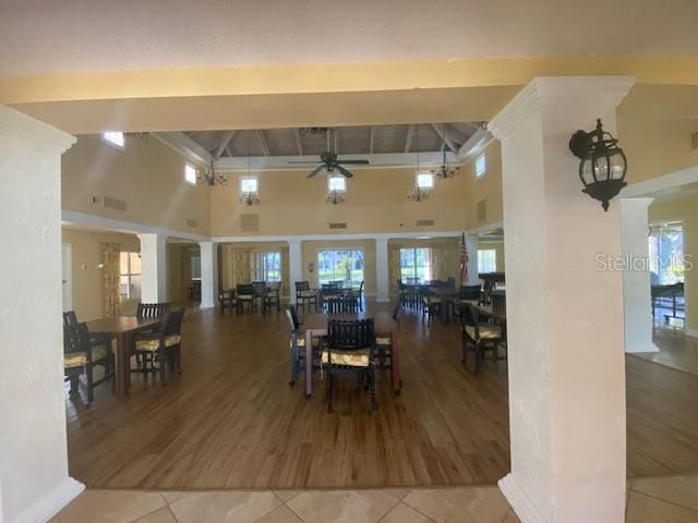 4570 Pinebrook Cir Unit 508, Bradenton, FL 34209 - tiled dining area with a high ceiling, ceiling fan, and beam ceiling