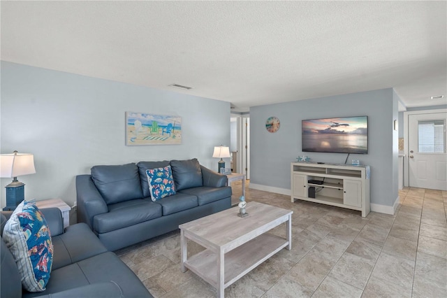 6150 Midnight Pass Rd Unit V4, Sarasota, FL 34242 - living room featuring a textured ceiling and baseboards