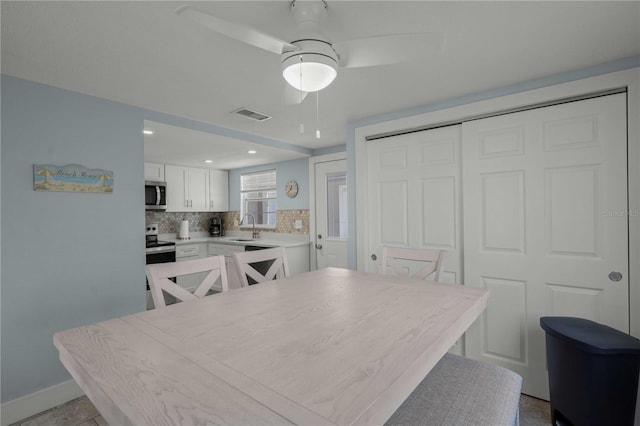 6150 Midnight Pass Rd Unit V4, Sarasota, FL 34242 - dining room with ceiling fan, baseboards, and recessed lighting