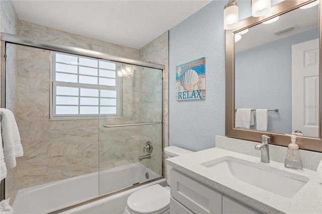 6150 Midnight Pass Rd Unit V4, Sarasota, FL 34242 - bathroom featuring toilet, vanity, a textured wall, and enclosed tub / shower combo
