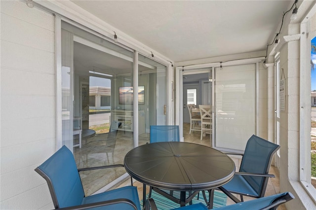 6150 Midnight Pass Rd Unit V4, Sarasota, FL 34242 - sunroom with outdoor dining area