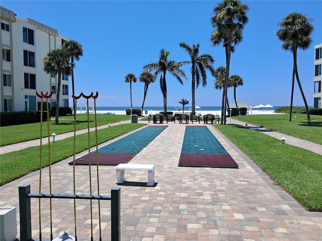 6150 Midnight Pass Rd Unit V4, Sarasota, FL 34242 - view of home's community featuring a water view, a yard, and shuffleboard