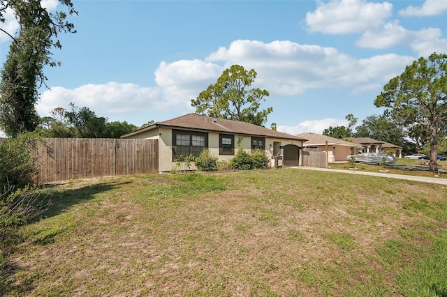 3881 Holin Ln, North Port, FL 34287 - ranch-style house featuring a garage, stucco siding, and driveway