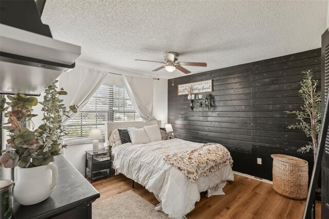 3881 Holin Ln, North Port, FL 34287 - bedroom featuring a textured ceiling, wood finished floors, and ceiling fan