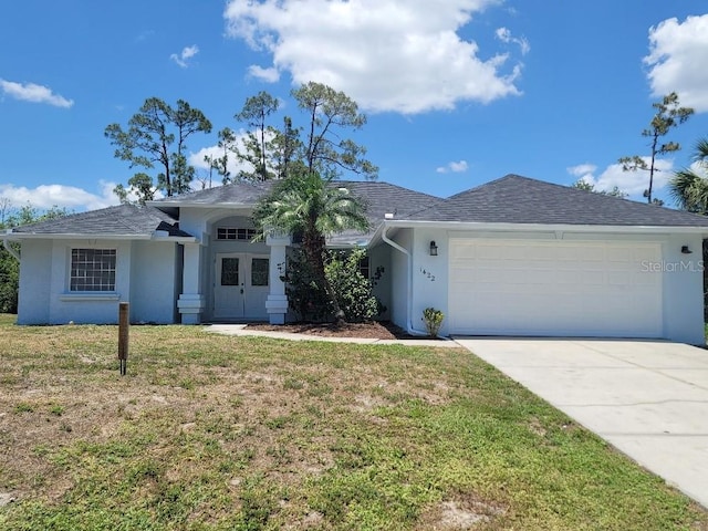 1422 Jakway Rd, North Port, FL 34288 - ranch-style house with stucco siding, an attached garage, a front lawn, concrete driveway, and a shingled roof
