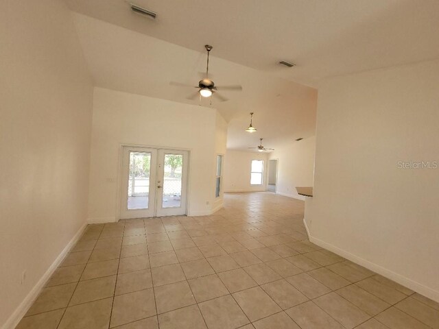 1422 Jakway Rd, North Port, FL 34288 - unfurnished room with ceiling fan, french doors, light tile patterned floors, baseboards, and lofted ceiling