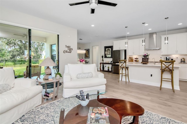 14787 Gallop Run Dr, Lithia, FL 33547 - living area featuring light wood finished floors, a ceiling fan, and recessed lighting