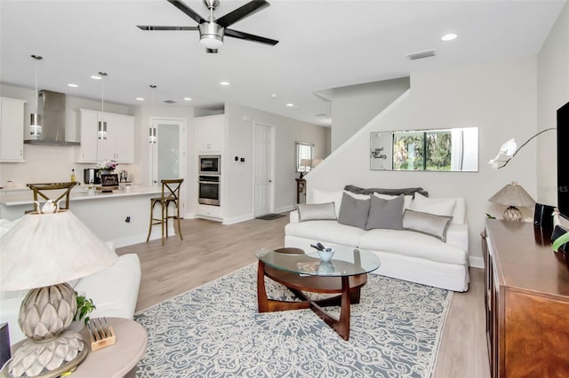 14787 Gallop Run Dr, Lithia, FL 33547 - living area featuring a ceiling fan, light wood-style flooring, stairway, and recessed lighting