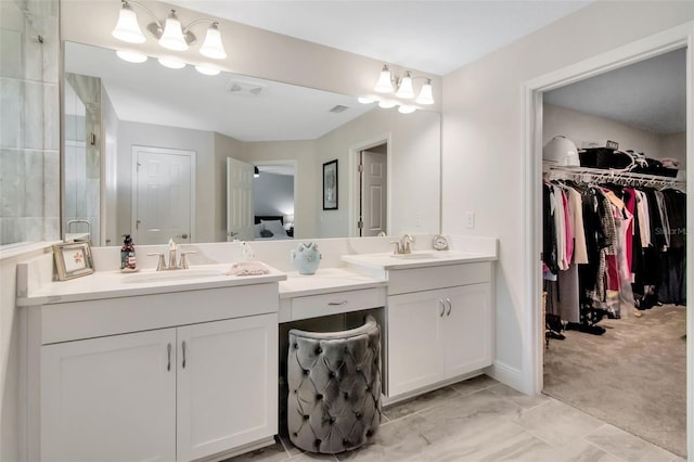 14787 Gallop Run Dr, Lithia, FL 33547 - bathroom featuring vanity, a walk in closet, and a chandelier