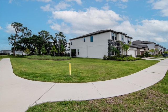 14787 Gallop Run Dr, Lithia, FL 33547 - view of home's exterior featuring a garage, a yard, stucco siding, and driveway