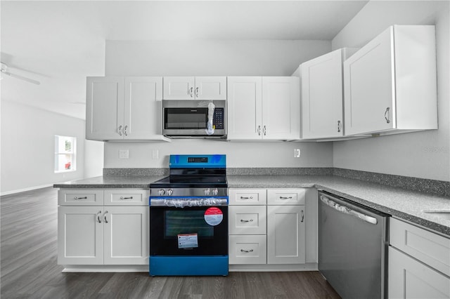 703 Salamanca Ct, Sebring, FL 33870 - kitchen with appliances with stainless steel finishes, dark wood-type flooring, and white cabinets