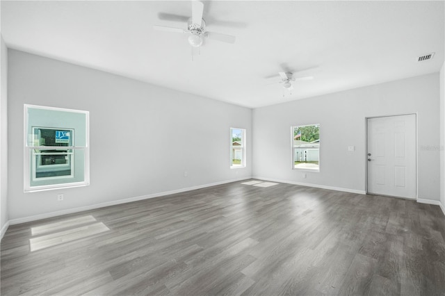 703 Salamanca Ct, Sebring, FL 33870 - unfurnished room with ceiling fan, wood finished floors, and baseboards