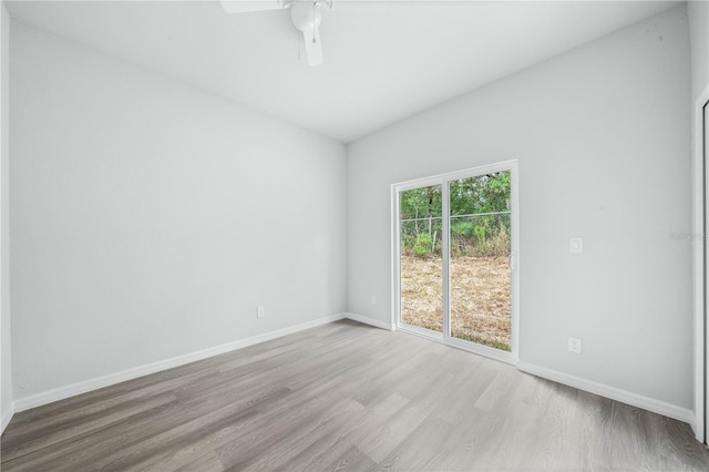 703 Salamanca Ct, Sebring, FL 33870 - spare room with wood finished floors, baseboards, and a ceiling fan