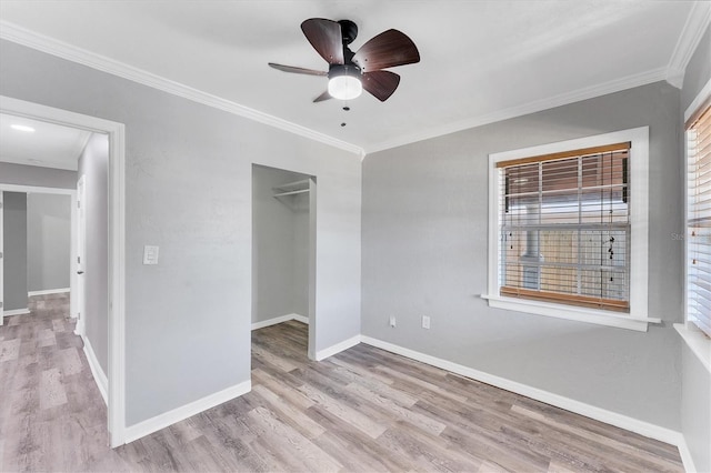 513 25th Ave W, Bradenton, FL 34205 - unfurnished bedroom with wood finished floors, crown molding, baseboards, a closet, and ceiling fan