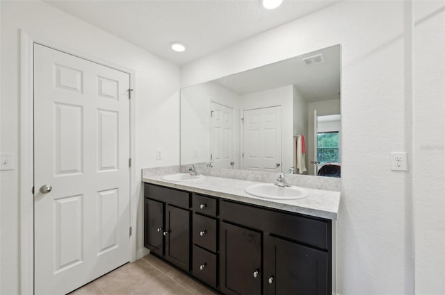 4091 Dull St, North Port, FL 34286 - full bathroom with double vanity and tile patterned flooring