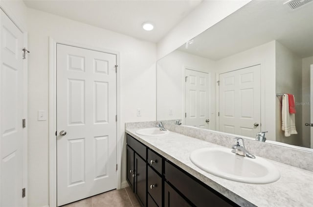 4091 Dull St, North Port, FL 34286 - bathroom featuring double vanity and tile patterned flooring