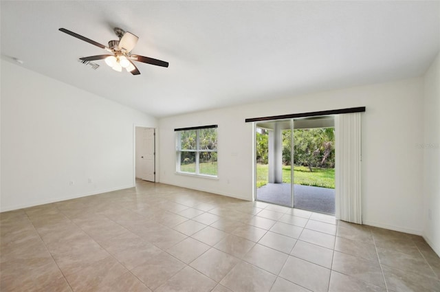 4091 Dull St, North Port, FL 34286 - empty room featuring lofted ceiling, light tile patterned floors, a ceiling fan, and baseboards