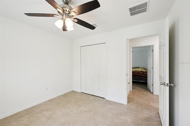 4091 Dull St, North Port, FL 34286 - unfurnished bedroom featuring light tile patterned floors, a closet, a ceiling fan, and baseboards
