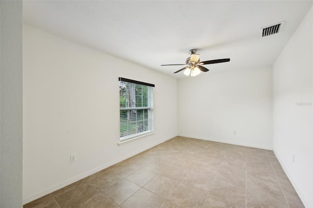 4091 Dull St, North Port, FL 34286 - empty room featuring a ceiling fan, light tile patterned flooring, and baseboards