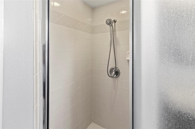 4758 Breezy Pines Blvd, Sarasota, FL 34232 - bathroom view of a stall shower and a textured wall