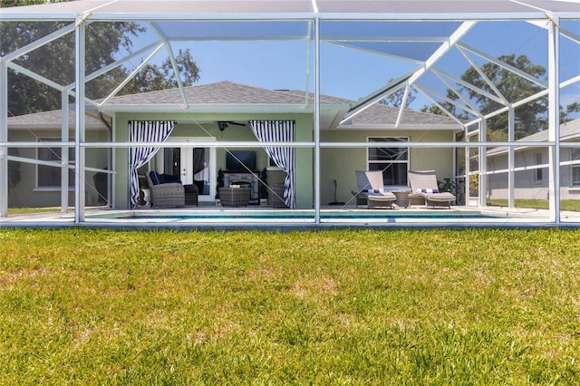 4758 Breezy Pines Blvd, Sarasota, FL 34232 - rear view of house with roof with shingles, outdoor lounge area, a lanai, and a yard