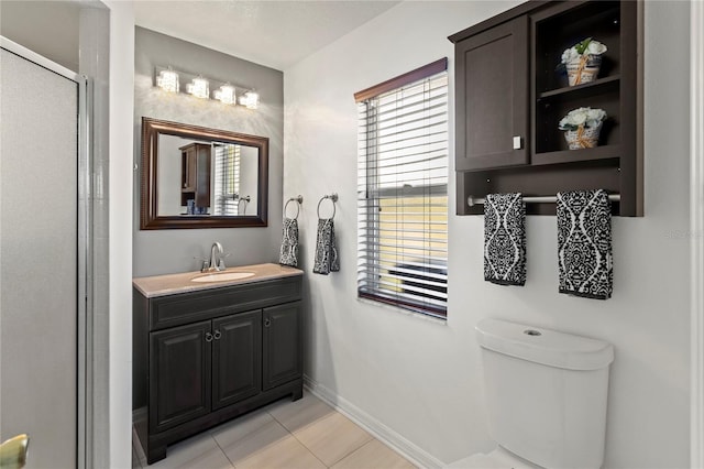 4758 Breezy Pines Blvd, Sarasota, FL 34232 - bathroom featuring vanity, toilet, tile patterned flooring, baseboards, and a stall shower