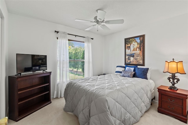 4758 Breezy Pines Blvd, Sarasota, FL 34232 - bedroom with light colored carpet, ceiling fan, and baseboards