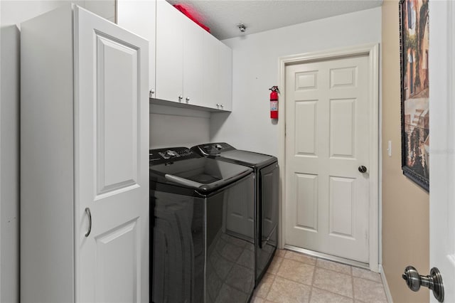 4758 Breezy Pines Blvd, Sarasota, FL 34232 - laundry area featuring washing machine and clothes dryer, cabinet space, and baseboards
