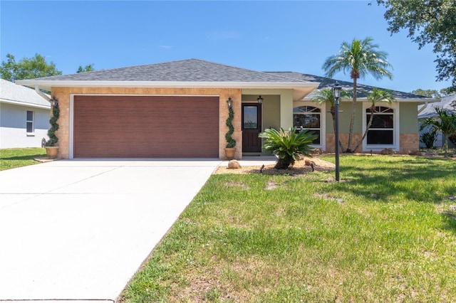 4758 Breezy Pines Blvd, Sarasota, FL 34232 - ranch-style house with a garage, driveway, a front yard, and stucco siding