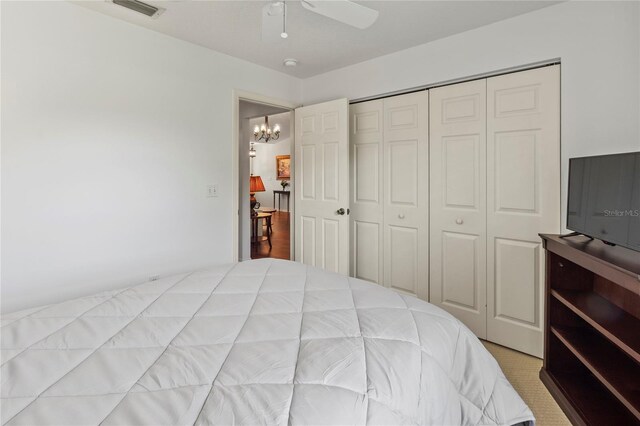 4758 Breezy Pines Blvd, Sarasota, FL 34232 - bedroom with a closet, a chandelier, and a ceiling fan