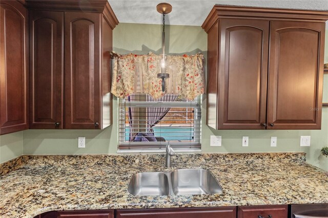 4758 Breezy Pines Blvd, Sarasota, FL 34232 - kitchen with a sink and light stone countertops